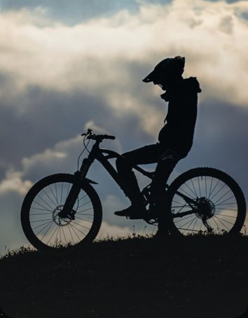 A mountain biker on a trail, captured with action camera